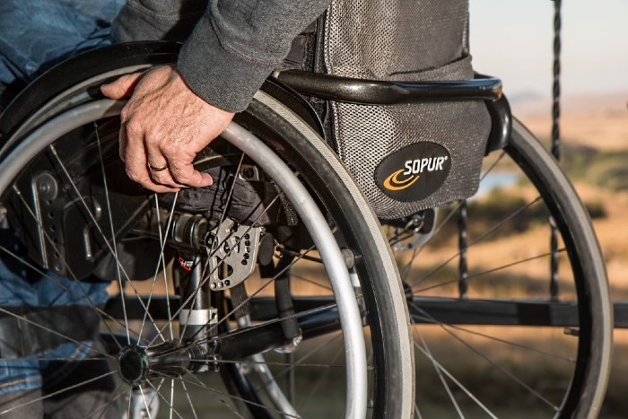 close up of a male in a wheelchair